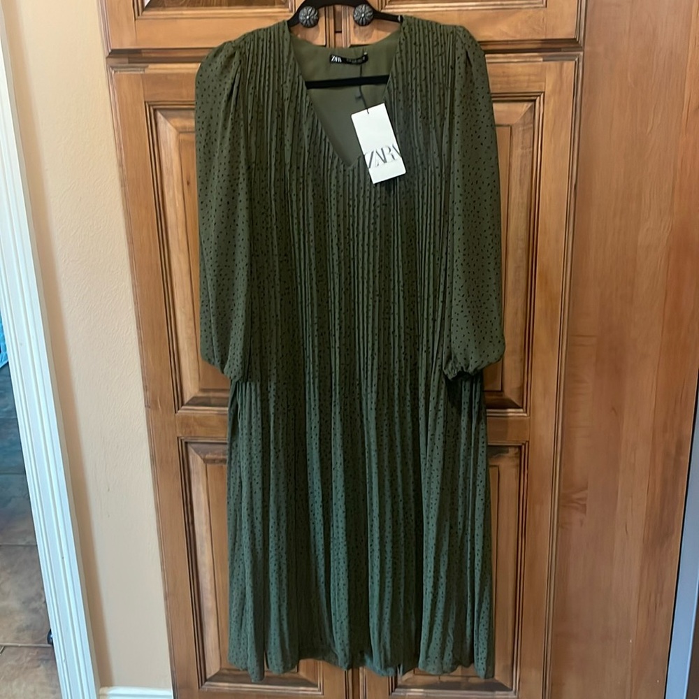 ZARA. approximately 46” long, sleeves are 23 “ with elastic at the wrist.